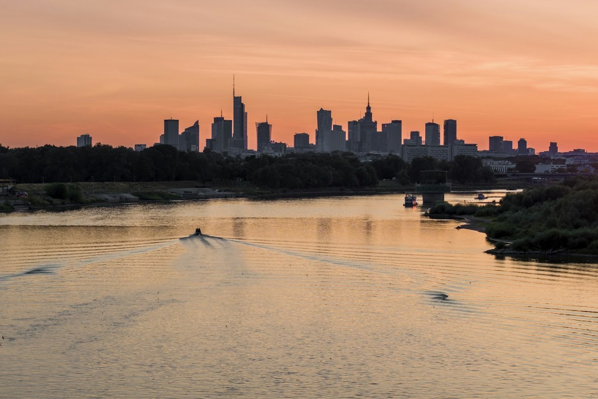 Warsaw skyline across the Vistula River at sunset