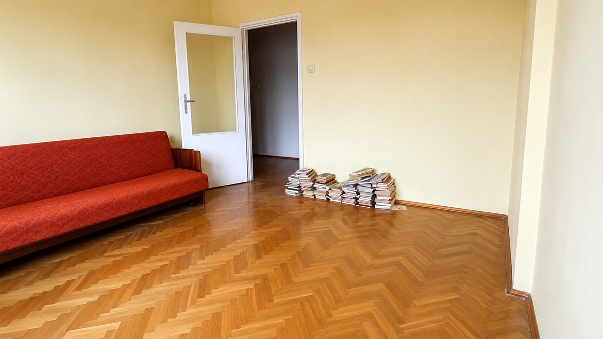 Room before renovation — worn wall and floor finish
