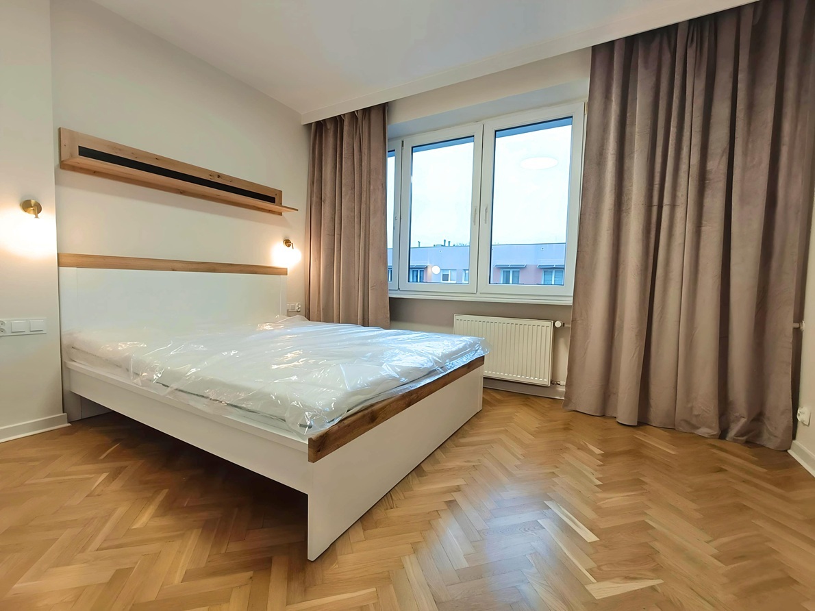 Bedroom after renovation with new furniture