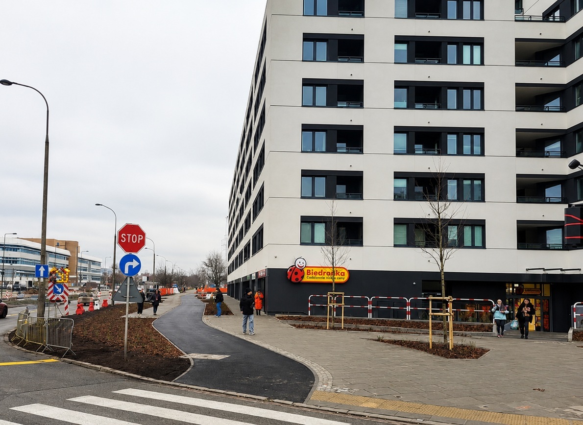 Modern apartment building with a Biedronka store on the ground floor in Ursynów, showing the district's typical mixed residential-retail character