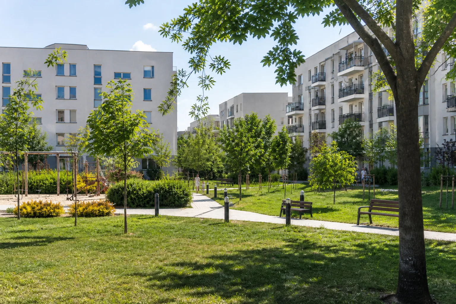 Sunny green residential park and family space in Warsaw Ursus