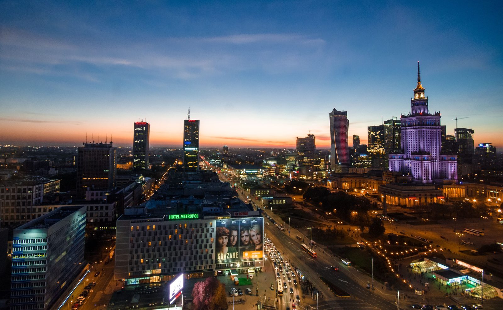 Warsaw city centre skyline in evening light representing a coordinated buyer search