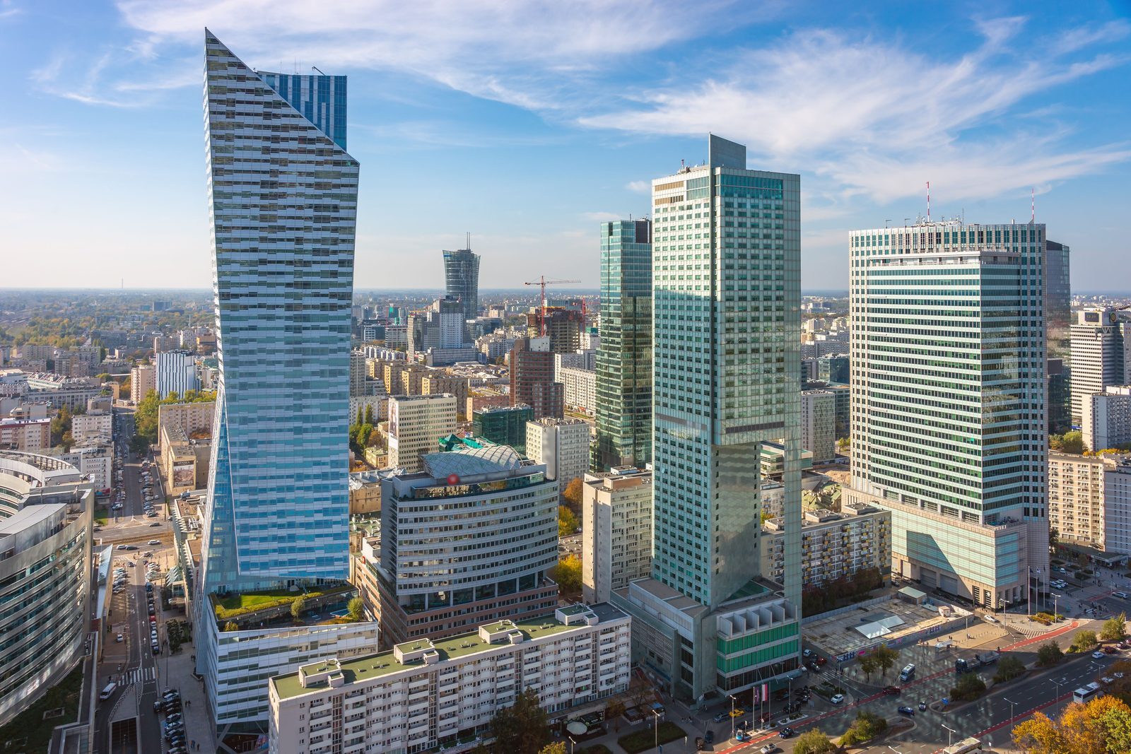 Modern Warsaw skyline in daylight viewed during a citywide property search