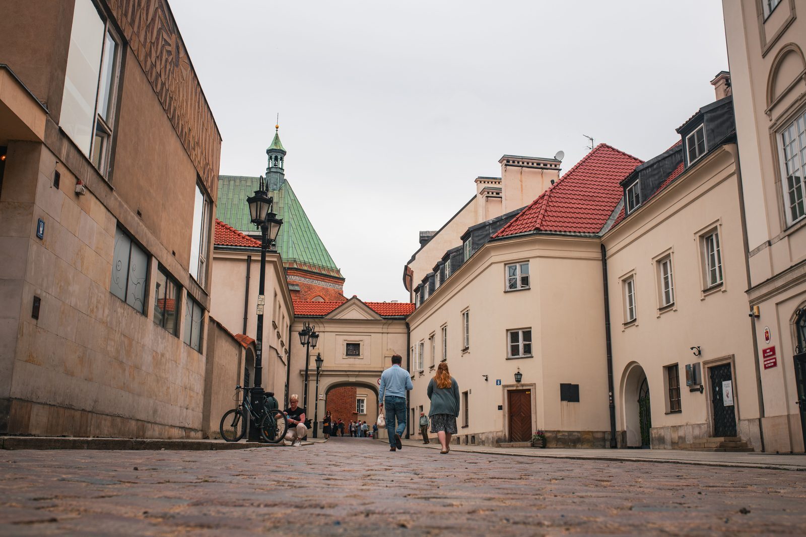 Warsaw Old Town cobbled street illustrating how location influences a property budget