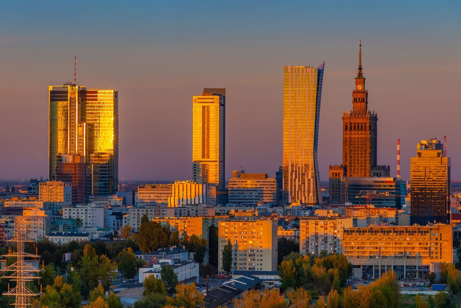 Warsaw skyline at golden hour illustrating a planned property purchase budget